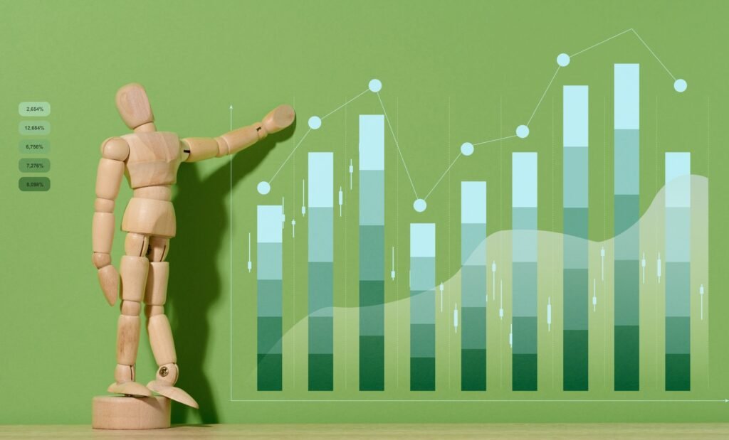 Wooden mannequin and graph with growing indicators on a green background.